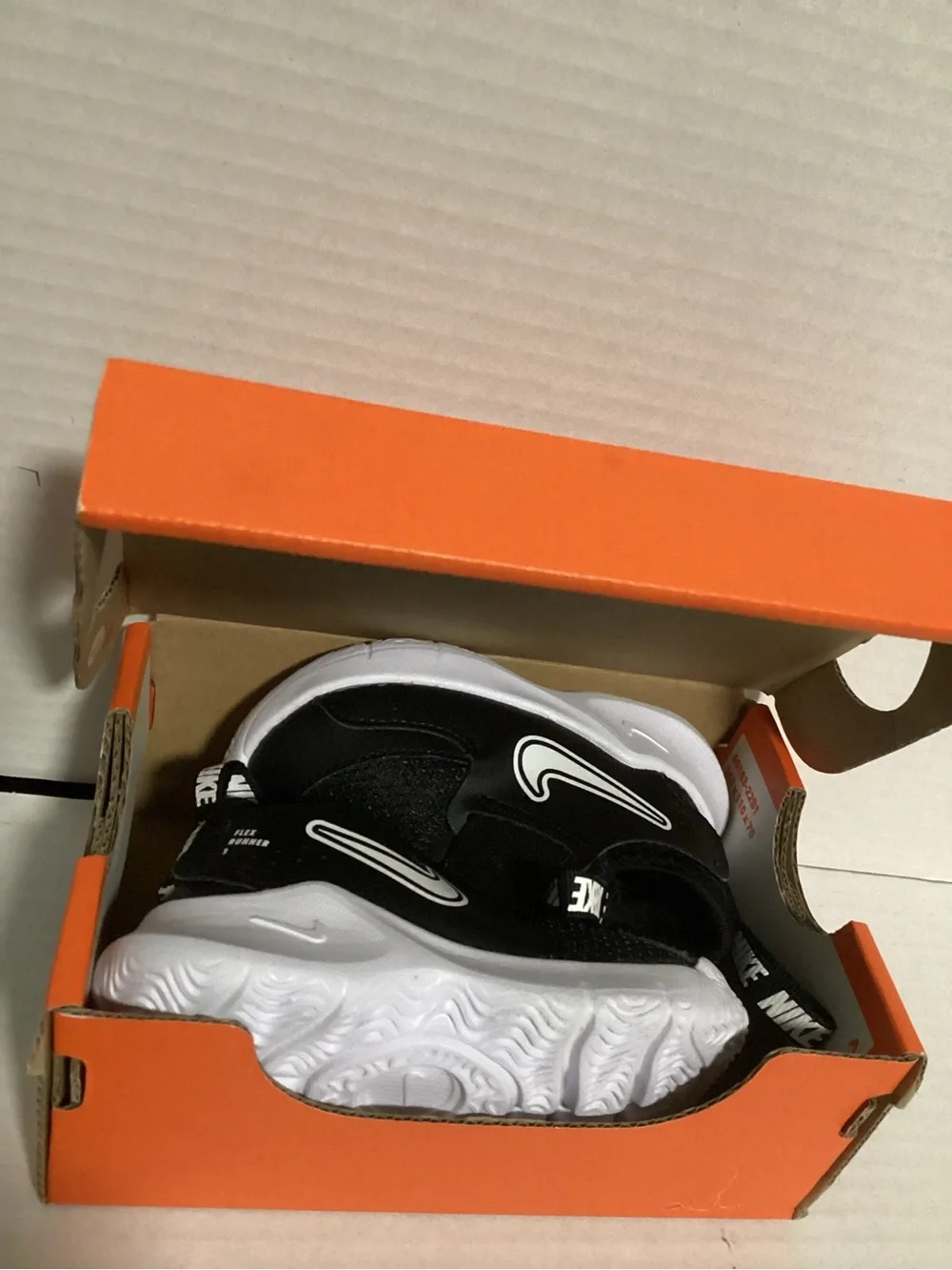 Nike Baby 3c Black & White Slip-On Sneakers with Easy Pull Tabs